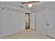 Bedroom featuring light colored walls and flooring, a window, and closet door at 508 E Brentridge, Brandon, FL 33511
