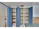 Pantry in kitchen with louvered doors and open shelving at 508 E Brentridge, Brandon, FL 33511