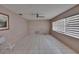 Bright, airy living room featuring tile flooring, a ceiling fan, and natural light from the window at 508 E Brentridge, Brandon, FL 33511