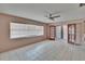 Bright, airy living room featuring tile flooring, a ceiling fan, and natural light from the window at 508 E Brentridge, Brandon, FL 33511