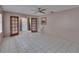 Bright, airy living room featuring tile flooring, a ceiling fan, and natural light from the window at 508 E Brentridge, Brandon, FL 33511