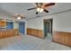 Open-concept living area with tile floors, ceiling fans, and wood-paneled accents at 508 E Brentridge, Brandon, FL 33511