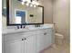 Bathroom featuring a double sink vanity and a toilet at 5636 Whitehead St, Bradenton, FL 34203