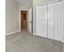 Neutral bedroom featuring carpet, a closet, and an open doorway at 5636 Whitehead St, Bradenton, FL 34203