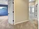 Hallway featuring carpet flooring, neutral walls, and access to various rooms at 5636 Whitehead St, Bradenton, FL 34203