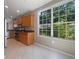 Bright kitchen with stainless steel appliances, granite countertops, and a large window offering scenic views at 5636 Whitehead St, Bradenton, FL 34203