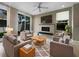 Contemporary living room with stylish furnishings, cozy fireplace, and ample natural light through sliding glass doors at 5636 Whitehead St, Bradenton, FL 34203