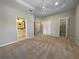 Expansive main bedroom with tray ceiling and access to bathroom, closets, and walk-in closet at 5636 Whitehead St, Bradenton, FL 34203
