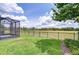 Lush green backyard with a screened-in patio and an open view at 5728 Watercolor Dr, Lithia, FL 33547
