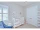 Charming Bedroom space with a white crib and soft pink accents at 5728 Watercolor Dr, Lithia, FL 33547