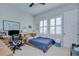 Well-lit bedroom featuring a comfy bed, desk, and bright windows at 5728 Watercolor Dr, Lithia, FL 33547