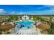 Beautiful community pool with splash pad, lounge chairs, pergolas, and ample space to relax at 5728 Watercolor Dr, Lithia, FL 33547