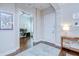Inviting home foyer with hardwood floors, light walls, and an adjacent office space at 5728 Watercolor Dr, Lithia, FL 33547