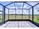 Screened patio with brick floors, beautiful view of the large open backyard at 5728 Watercolor Dr, Lithia, FL 33547