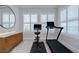 Bright sitting area with exercise equipment and plantation shutters, offering a tranquil space at 5728 Watercolor Dr, Lithia, FL 33547
