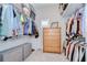 Spacious walk-in closet with ample shelving, drawer unit, and convenient storage solutions at 5728 Watercolor Dr, Lithia, FL 33547