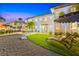 A plush lawn, chaise lounges, a cornhole game, and an outdoor dining set makes this backyard a relaxing haven at 650 70Th Ave, St Pete Beach, FL 33706
