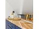 Close-up of bar with decorative items on the countertop with sleek appliances at 650 70Th Ave, St Pete Beach, FL 33706