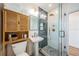 Beautiful bathroom featuring tiled shower, modern lighting, and a pedestal sink at 650 70Th Ave, St Pete Beach, FL 33706