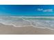 Calm ocean view with gentle waves and a clear blue sky on a sandy beach at 650 70Th Ave, St Pete Beach, FL 33706