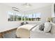 Inviting bedroom showcasing large windows and a comfortable seating area at 650 70Th Ave, St Pete Beach, FL 33706