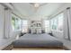 Bright bedroom featuring modern decor, lots of natural light, and ceiling fan at 650 70Th Ave, St Pete Beach, FL 33706
