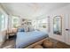 Bright bedroom with ample natural light, modern decor, and comfortable furnishings at 650 70Th Ave, St Pete Beach, FL 33706