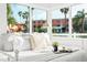 Serene bedroom showcasing large windows providing ample natural light and outdoor views at 650 70Th Ave, St Pete Beach, FL 33706