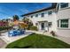 Stunning exterior featuring well maintained landscaping, a table with sunshade and a blue door at 650 70Th Ave, St Pete Beach, FL 33706