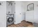 Modern laundry area featuring updated machines, new flooring, and a clean design at 650 70Th Ave, St Pete Beach, FL 33706