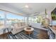 Bright and airy living room featuring a scenic view, comfortable seating, and stylish design at 650 70Th Ave, St Pete Beach, FL 33706