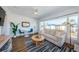 Well-lit living room with cozy sofa, accent lighting, and a lovely view of the city at 650 70Th Ave, St Pete Beach, FL 33706