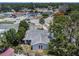 Aerial shot of house with mature landscaping in a suburban neighborhood at 7004 Lambright Ct, Tampa, FL 33634