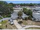 Aerial shot of home with palm tree, mature landscaping and driveway in a suburban neighborhood at 7004 Lambright Ct, Tampa, FL 33634