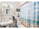 Bathroom featuring a toilet, sink, medicine cabinet and shower at 7004 Lambright Ct, Tampa, FL 33634