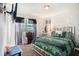 This bedroom features a large bed, natural light, and neutral colored walls at 7004 Lambright Ct, Tampa, FL 33634