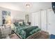 Bedroom with a large bed, mirrored nightstand, closet, and carpet at 7004 Lambright Ct, Tampa, FL 33634