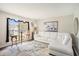 Cozy living room with a white sofa, decorative rug, and natural light, creating an inviting space at 7004 Lambright Ct, Tampa, FL 33634