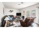 Comfortable living room with ample seating, creating a relaxing space for entertaining or unwinding at 7004 Lambright Ct, Tampa, FL 33634