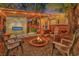 Backyard retreat with a fireplace, hot tub, fire pit, and a charming pergola at 7010 N Hubert Ave, Tampa, FL 33614
