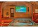 Backyard patio with hot tub and movie screen at 7010 N Hubert Ave, Tampa, FL 33614