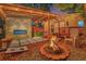 Outdoor space with fireplace, fire pit, and hot tub, designed for entertaining at 7010 N Hubert Ave, Tampa, FL 33614