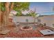 Backyard featuring a fire pit and outdoor seating, perfect for relaxation at 7010 N Hubert Ave, Tampa, FL 33614