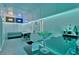 Finished basement bar with modern lighting, countertop seating, and entertainment area at 7010 N Hubert Ave, Tampa, FL 33614