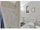 Clean and functional bathroom featuring a shower stall and toilet with updated fixtures and decor at 7010 N Hubert Ave, Tampa, FL 33614