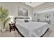 This bedroom has a Queen-sized bed, a green plant and a framed piece of artwork at 7010 N Hubert Ave, Tampa, FL 33614