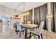 Dining room with a fireplace and gray chairs at 7010 N Hubert Ave, Tampa, FL 33614
