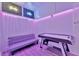 Finished basement game room with air hockey, couch, and neon lighting at 7010 N Hubert Ave, Tampa, FL 33614