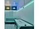 Finished basement game room with air hockey, couch, and neon decor at 7010 N Hubert Ave, Tampa, FL 33614
