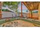 Backyard hot tub in a yard, with string lights and nice landscaping at 7010 N Hubert Ave, Tampa, FL 33614